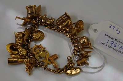 Lot 176A - A 9ct gold charm bracelet suspending various...