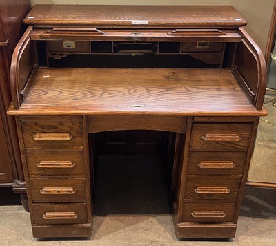 Lot 701 - A vintage oak roll top desk, 106cm wide.