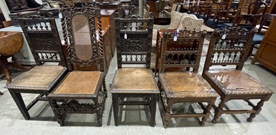 Lot 730 - A pair of chip carved oak hall chairs, the...
