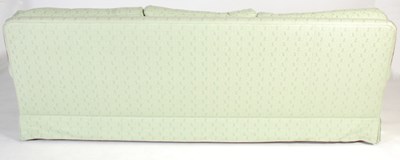 Lot 12 - A green upholstered three seat sofa with loose...