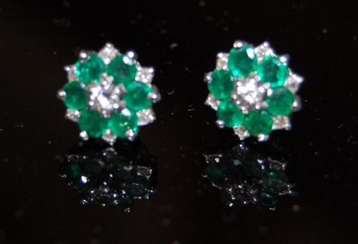 Lot 176M - A pair of white metal diamond and emerald...