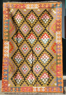 Lot 174 - A Maimana Kilim rug, the ochre coloured ground...