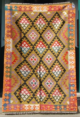 Lot 174 - A Maimana Kilim rug, the ochre coloured ground...