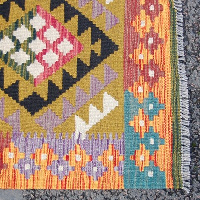 Lot 174 - A Maimana Kilim rug, the ochre coloured ground...