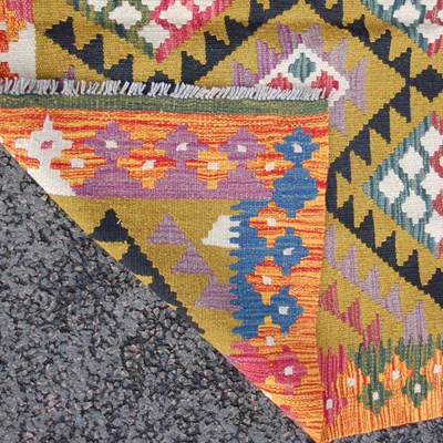 Lot 174 - A Maimana Kilim rug, the ochre coloured ground...