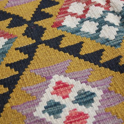 Lot 174 - A Maimana Kilim rug, the ochre coloured ground...