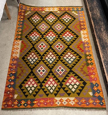 Lot 174 - A Maimana Kilim rug, the ochre coloured ground...
