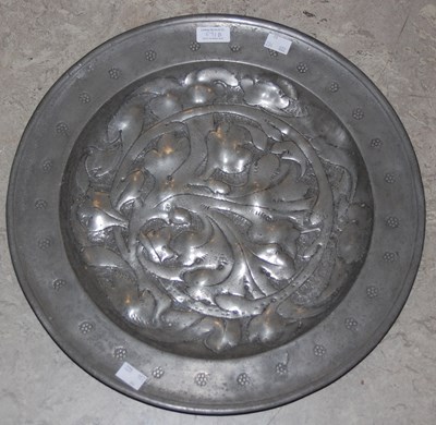 Lot 571B - An 18th century large pewter charger, the...