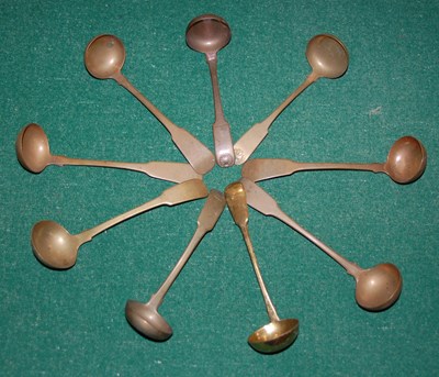 Lot 570E - A group of nine brass fiddle-pattern toddy...