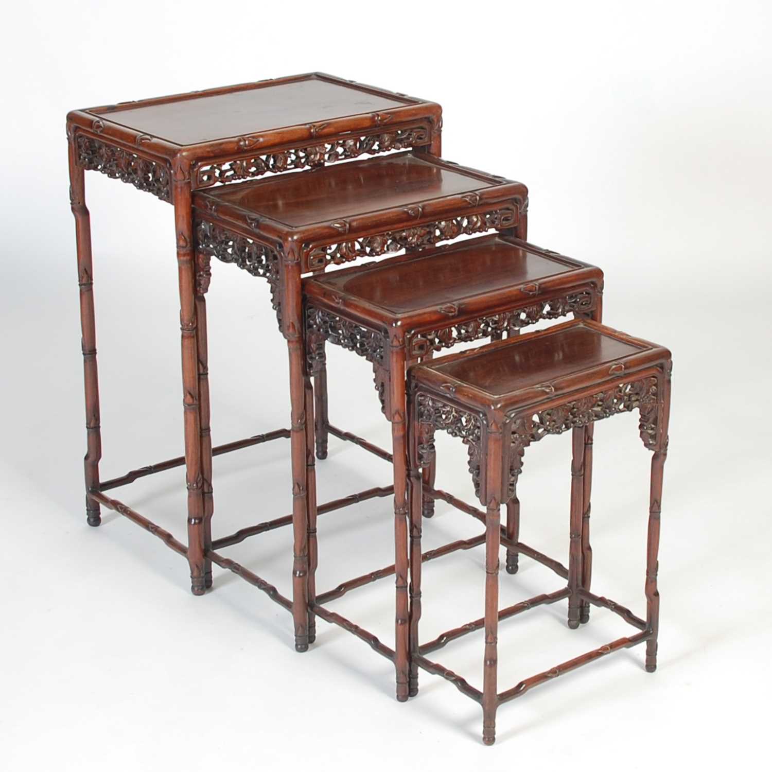 Lot 139 - A nest of four Chinese darkwood occasional...