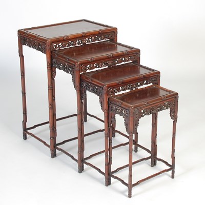 Lot 139 - A nest of four Chinese darkwood occasional...