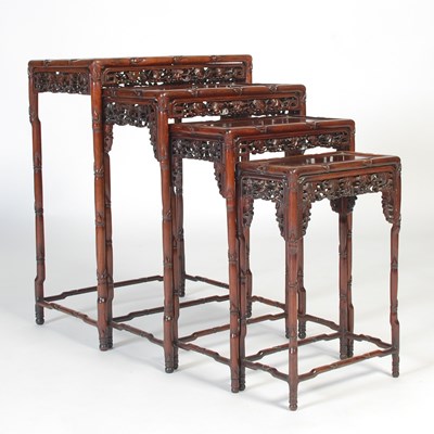 Lot 139 - A nest of four Chinese darkwood occasional...