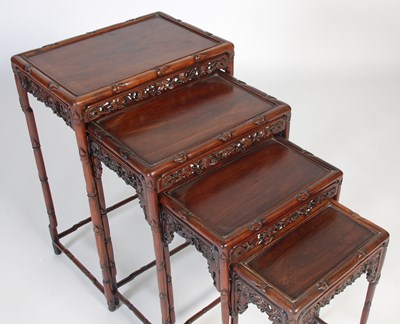 Lot 139 - A nest of four Chinese darkwood occasional...