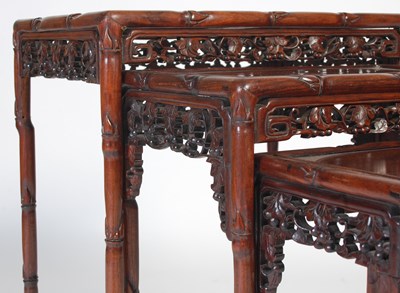 Lot 139 - A nest of four Chinese darkwood occasional...
