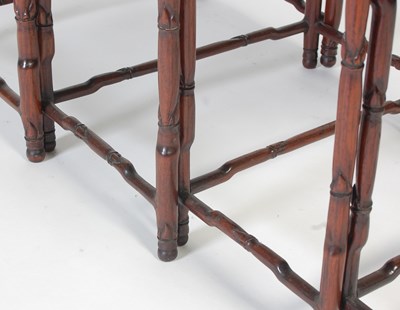 Lot 139 - A nest of four Chinese darkwood occasional...