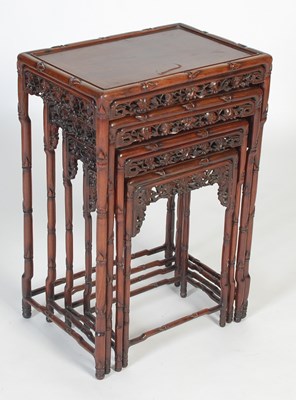 Lot 139 - A nest of four Chinese darkwood occasional...