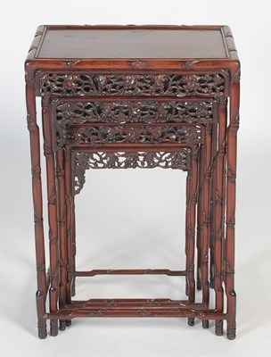 Lot 139 - A nest of four Chinese darkwood occasional...