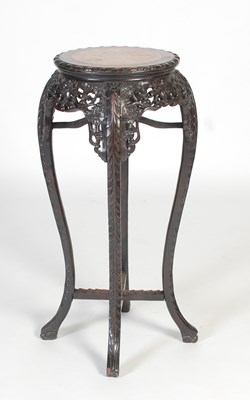 Lot 135 - A Chinese darkwood urn stand, late Qing...