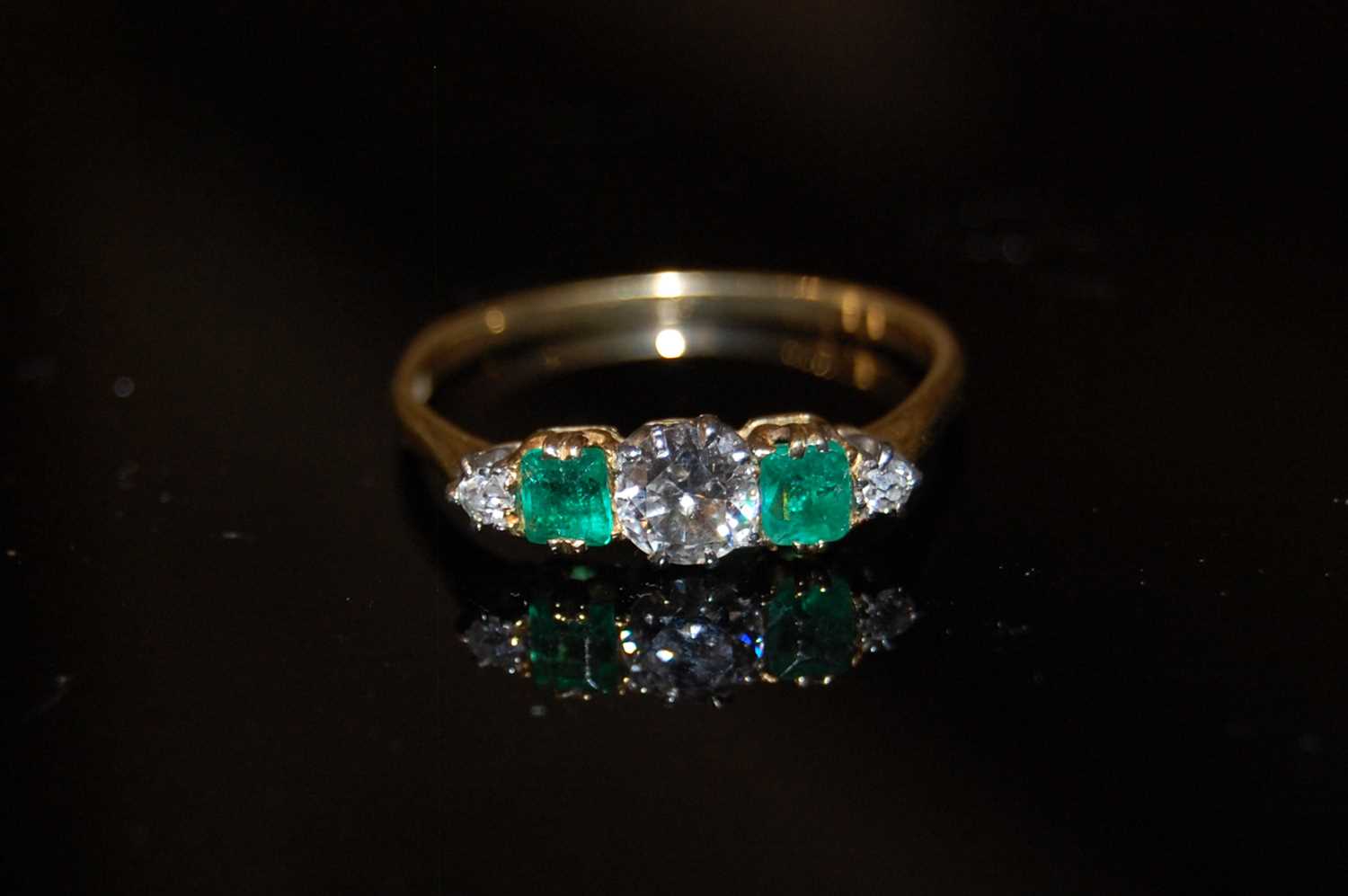 Lot 177 - A yellow metal, diamond and emerald five stone...