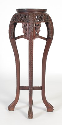 Lot 35 - A Chinese darkwood urn stand, late Qing...