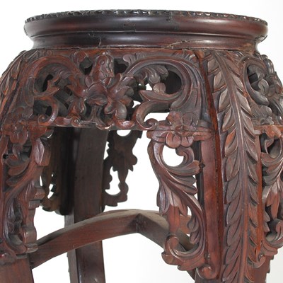 Lot 35 - A Chinese darkwood urn stand, late Qing...