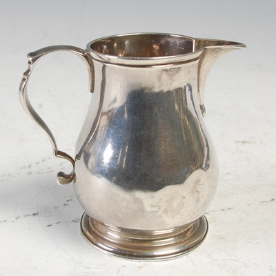 Lot 484 - A George II silver ‘sparrow beak’ cream jug,...