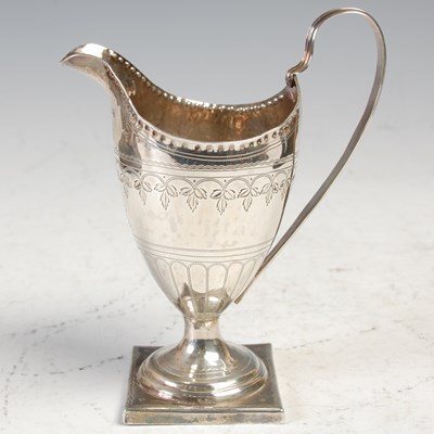 Lot 470 - A George III silver helmet shaped cream jug,...
