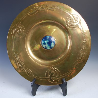 Lot 185 - A Glasgow School large brass charger, in the...