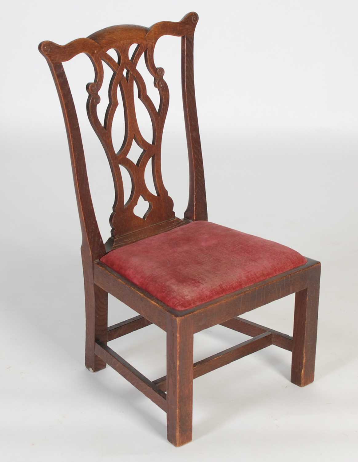 Lot 43 - A Scottish oak ‘gossip’ chair, by William...