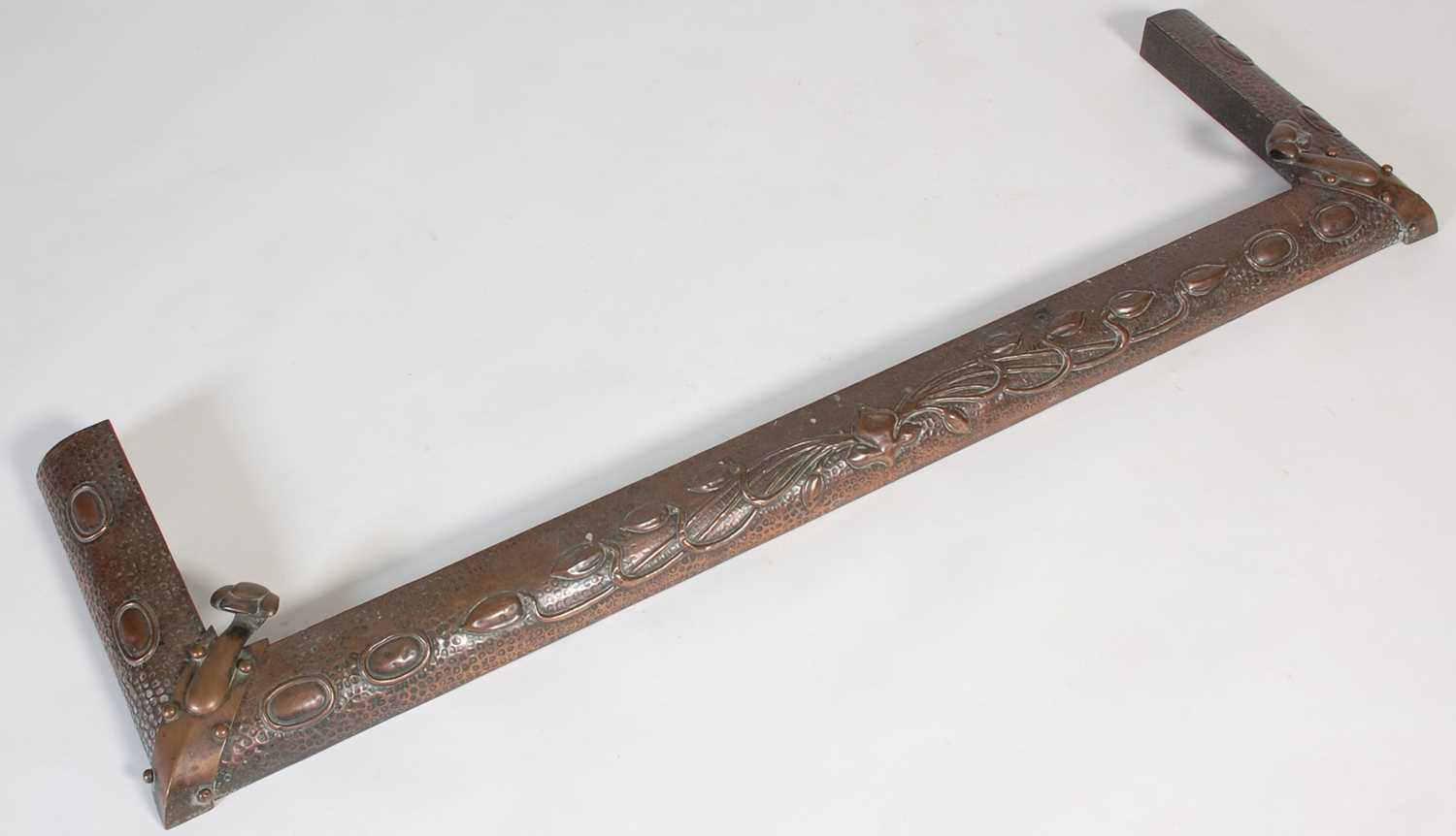 Lot 209 - An Art Nouveau copper fender, embossed with...