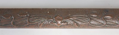 Lot 209 - An Art Nouveau copper fender, embossed with...