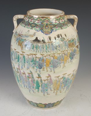 Lot 833 - A Japanese Satsuma pottery twin handled vase,...