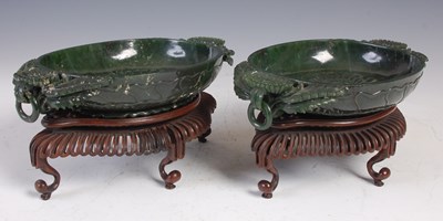Lot 828 - A pair of Chinese green stone, probably jade,...