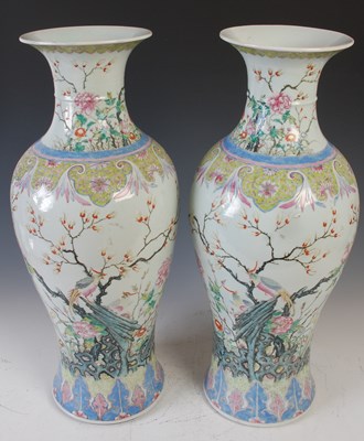 Lot 812 - A pair of Chinese porcelain famille rose vases,...