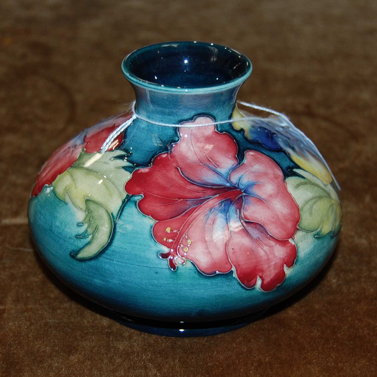 Lot 208 A Moorcroft pottery green ground vase,