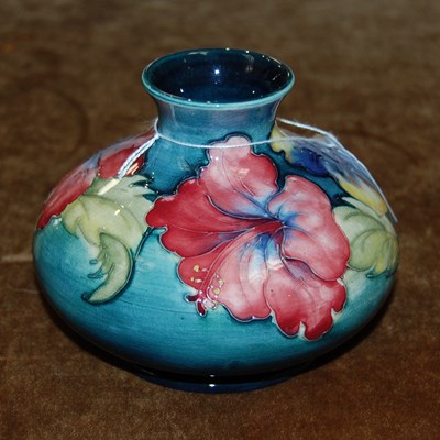 Lot 208A - A Moorcroft pottery green ground vase,...