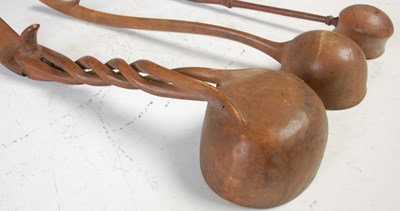 Lot 247 - A collection of three various antique treen...