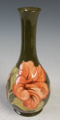 Lot 750 - A Moorcroft Hibiscus pattern green ground vase,...