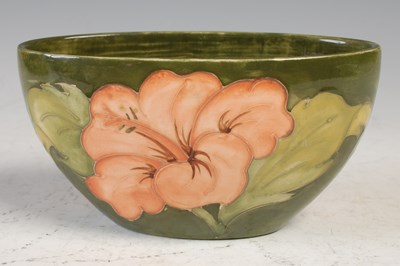 Lot 756 - A Moorcroft Hibiscus pattern green ground oval...