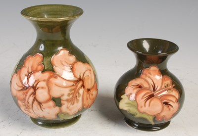 Lot 755 - Two Moorcroft Hibiscus pattern green ground...