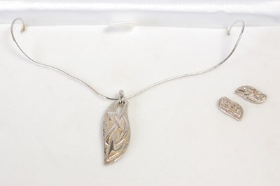 Lot 566 - A cased Ortak silver Celtic Collection pendant...