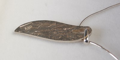 Lot 566 - A cased Ortak silver Celtic Collection pendant...