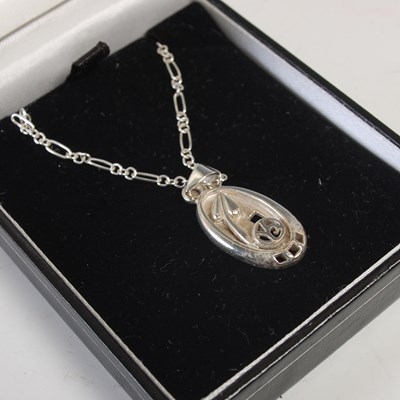 Lot 566 - A cased Ortak silver Celtic Collection pendant...
