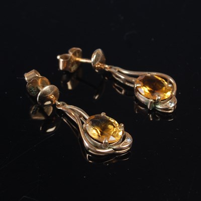 Lot 532 - A pair of yellow metal drop earrings, each set...