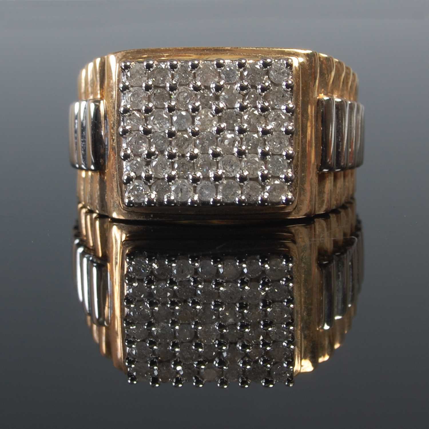 Lot 650 - A 9ct yellow and white gold gem set gentlemans...