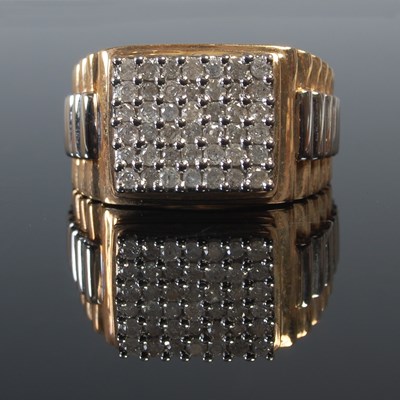 Lot 650 - A 9ct yellow and white gold gem set gentlemans...