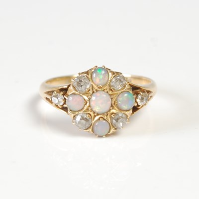 Lot 631 - An 18ct gold, opal and diamond dress...