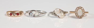Lot 562 - A group of four assorted rings, to include a...