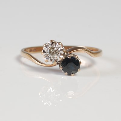 Lot 622 - A 9ct gold, diamond and sapphire two stone...