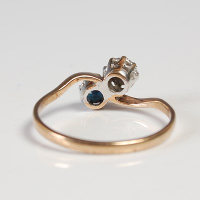 Lot 622 - A 9ct gold, diamond and sapphire two stone...